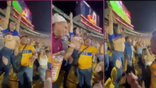 Mulher sem roupa exibindo o corpo nos arquibancadas do estádio